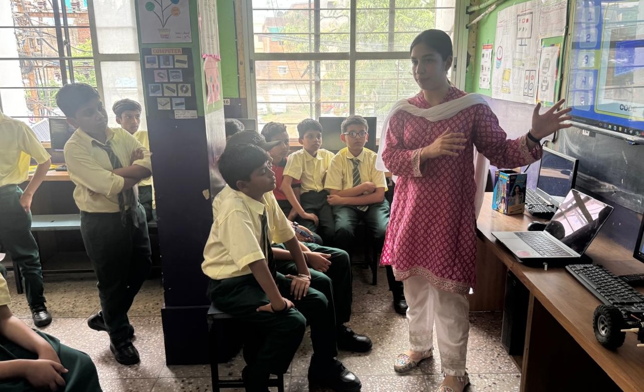 DreamBig volunteer presenting a coding project to students