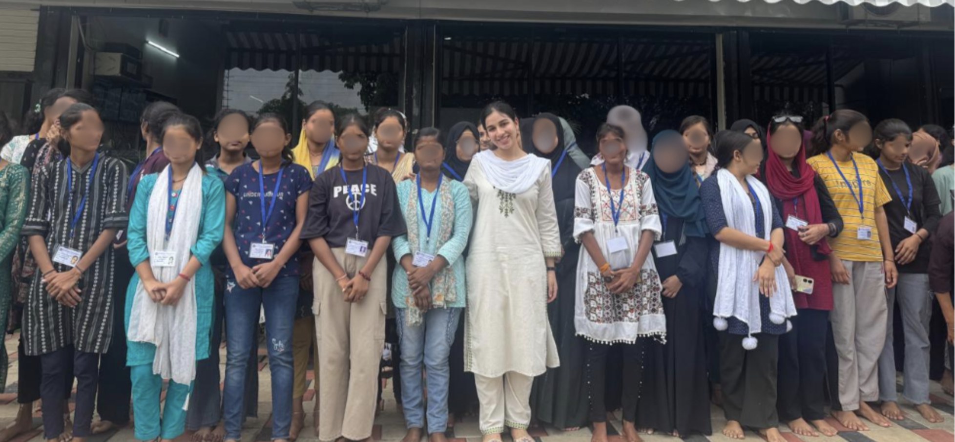 Afia with a group of students outside the Lifeline Foundation center, faces blurred for privacy